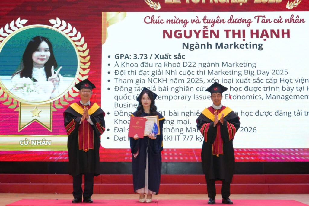 PTIT Marketing runner-up valedictorian Nguyen Thi Hanh receives her diploma at the 2026 graduation ceremony